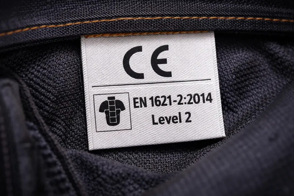 CE Rating Explained: What Do Motorcycle Armor Levels Mean? 2 CE certification label close-up showing EN 1621-2 Level 2 standard on back protector